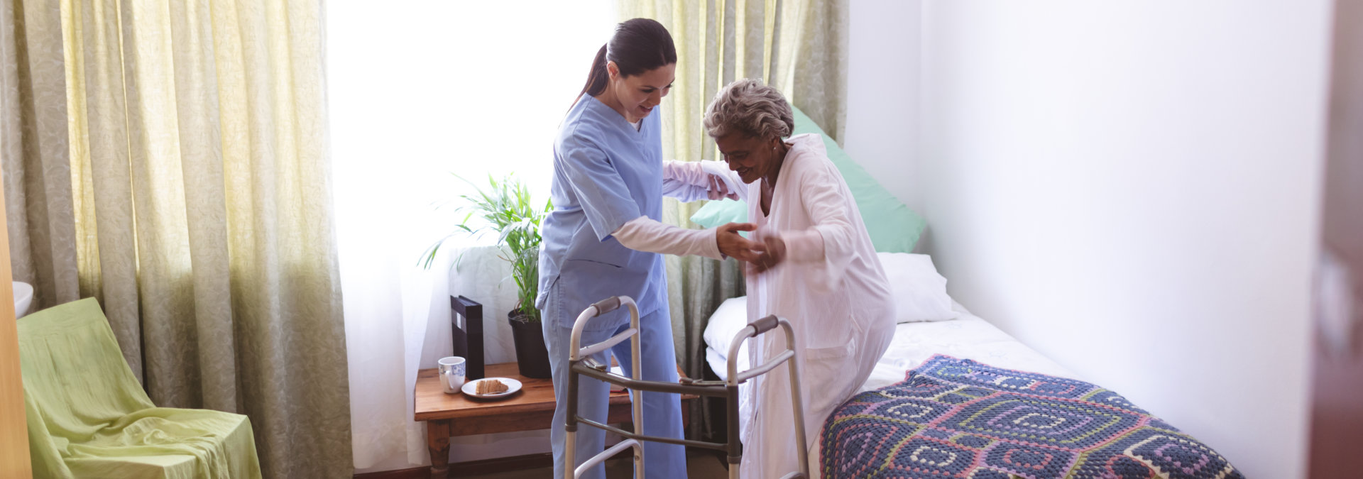 nurse is helping the senior woman