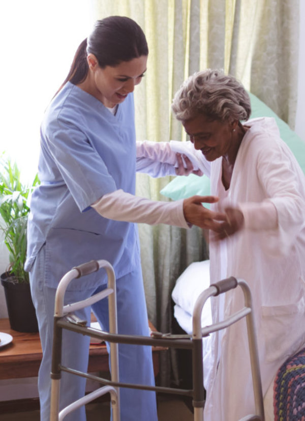 nurse is helping the senior woman