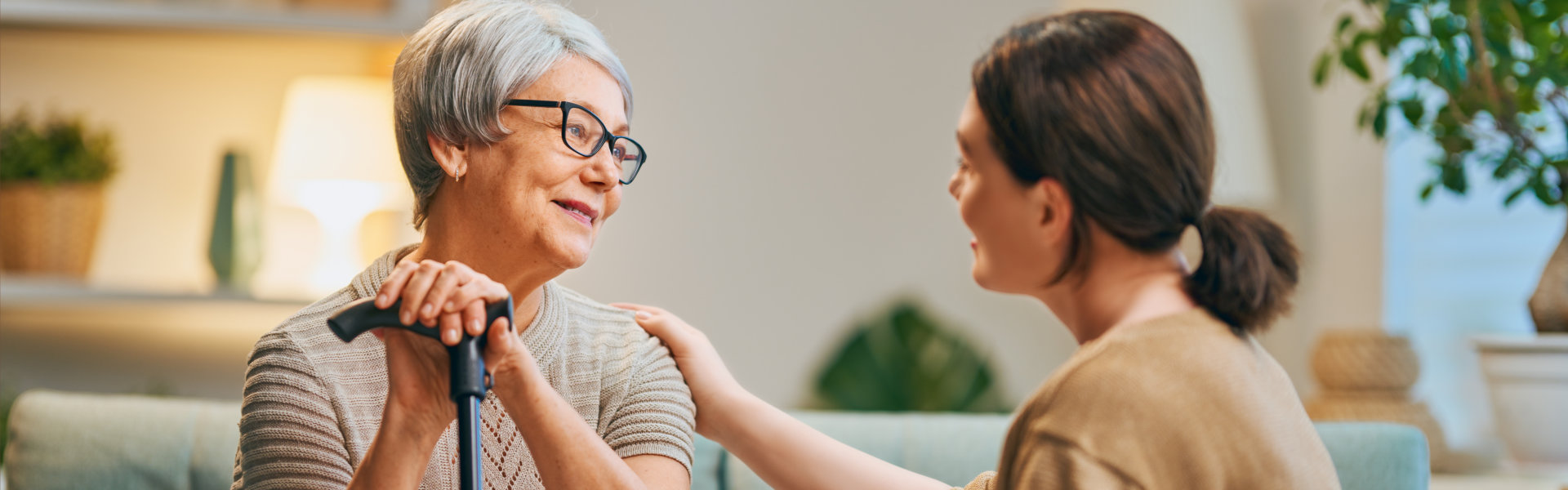 woman put his hand on the shoulder to senior woman